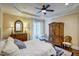The bedroom has a ceiling fan, wood floors, and access to a private balcony at 2307 Carriage Oaks Dr, Raleigh, NC 27614