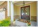 Charming front entrance featuring double doors, decorative wreaths, and well-placed potted plants at 2307 Carriage Oaks Dr, Raleigh, NC 27614