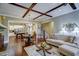 Cozy living room open to the kitchen and dining area with hardwood floors and stylish decor at 2307 Carriage Oaks Dr, Raleigh, NC 27614