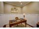 Home office with natural light, traditional desk, and wainscoting for a classic aesthetic at 2307 Carriage Oaks Dr, Raleigh, NC 27614