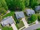 Aerial view of a home featuring a driveway, landscaped yard and neighborhood at 2412 Castleburg Dr, Apex, NC 27523