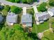Aerial view of the home with deck, landscaped backyard, and neighborhood street at 2412 Castleburg Dr, Apex, NC 27523
