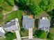 An aerial view of home with back deck, patio and surrounding neighborhood at 2412 Castleburg Dr, Apex, NC 27523