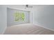 Bedroom with neutral carpet and lots of natural light at 2412 Castleburg Dr, Apex, NC 27523