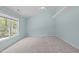 Spacious bedroom with high ceiling and large window at 2412 Castleburg Dr, Apex, NC 27523