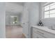 Bright foyer featuring hardwood floors, chandelier, and access to the dining area at 2412 Castleburg Dr, Apex, NC 27523