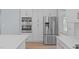 Kitchen showcasing stainless steel refrigerator, and ample cabinet space at 2412 Castleburg Dr, Apex, NC 27523