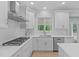 Updated kitchen with stainless steel appliances, gas cooktop, and white tile backsplash at 2412 Castleburg Dr, Apex, NC 27523