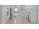 Bright, open kitchen featuring stainless steel appliances and a center island at 2412 Castleburg Dr, Apex, NC 27523