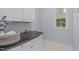 Laundry room with cabinets and counterspace at 2412 Castleburg Dr, Apex, NC 27523