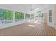 Well-lit screened porch area with dual hanging hammocks and wooded view at 2412 Castleburg Dr, Apex, NC 27523