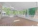 Relaxing screened porch area with dual hanging hammocks and wooded view at 2412 Castleburg Dr, Apex, NC 27523