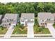 Aerial view of a home with a well-kept lawn, surrounded by trees, showcasing curb appeal at 2912 Historic Cir, Morrisville, NC 27560
