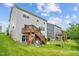 Expansive backyard with deck, patio area, and swing set, ideal for outdoor enjoyment at 2912 Historic Cir, Morrisville, NC 27560