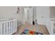 Spacious Bedroom with three cribs and adjacent bathroom access at 2912 Historic Cir, Morrisville, NC 27560