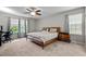 Tranquil bedroom with carpet, large windows, and comfortable furnishings at 2912 Historic Cir, Morrisville, NC 27560