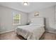 Cozy bedroom features neutral colors, carpet, and a window that lets in natural light at 2912 Historic Cir, Morrisville, NC 27560