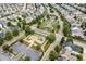 Aerial view of a playground, parking lot, and landscaped park area within a residential community surrounded by homes at 2912 Historic Cir, Morrisville, NC 27560