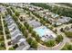 Aerial image of a community pool and clubhouse surrounded by lush greenery and residential homes in a Gathering neighborhood at 2912 Historic Cir, Morrisville, NC 27560