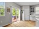 Inviting dining area with sliding glass door to a deck and adjacent kitchen space at 2912 Historic Cir, Morrisville, NC 27560
