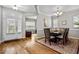 Elegant dining room with wood floors, decorative rug, and a chandelier at 2912 Historic Cir, Morrisville, NC 27560
