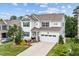 Attractive home featuring a two-car garage, manicured landscaping, and a welcoming front porch at 2912 Historic Cir, Morrisville, NC 27560