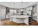 Bright kitchen featuring an island, modern appliances, and ample cabinet space at 2912 Historic Cir, Morrisville, NC 27560