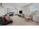Spacious living room with plush carpet, ceiling fan, and lots of natural light at 2912 Historic Cir, Morrisville, NC 27560