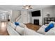 Cozy living room showcasing a fireplace, large TV, and comfortable seating area at 2912 Historic Cir, Morrisville, NC 27560