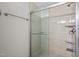 Modern walk-in shower with glass enclosure and neutral tiled walls at 2912 Historic Cir, Morrisville, NC 27560