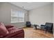 Cozy sitting room with hardwood floors, a large window and comfortable seating at 2912 Historic Cir, Morrisville, NC 27560