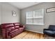 Cozy sitting room featuring hardwood floors, a large window, and comfortable seating at 2912 Historic Cir, Morrisville, NC 27560
