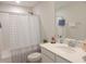 Bathroom with a polka dot shower curtain, white vanity, and a chrome faucet at 3005 Dunnock Dr, Durham, NC 27713