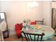 Dining area featuring a table, chairs, bright lighting and a view at 3005 Dunnock Dr, Durham, NC 27713