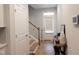 Bright foyer with hardwood floors, coat closet, and staircase to upper level at 3005 Dunnock Dr, Durham, NC 27713
