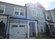 Well-maintained two-story townhome with attached one car garage, appealing curb appeal at 3005 Dunnock Dr, Durham, NC 27713