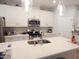 Stylish kitchen with stainless steel appliances, granite countertops, and decorative pendant lighting at 3005 Dunnock Dr, Durham, NC 27713