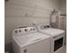 Laundry room featuring a Whirlpool washer and dryer, with wire shelving above at 3005 Dunnock Dr, Durham, NC 27713