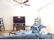 Inviting living room with a large blue sectional, perfect for relaxing or entertaining at 3005 Dunnock Dr, Durham, NC 27713
