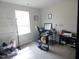 Bright home office with neutral walls, a modern desk, and a window for natural light at 3005 Dunnock Dr, Durham, NC 27713
