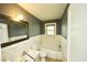 This bathroom has a toilet, sink, bathtub and shower, and a window at 315 Clark St, Durham, NC 27701