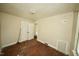 This bedroom has a closet, a window, and hardwood floors at 315 Clark St, Durham, NC 27701