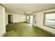 Open concept living room with great natural light, multiple windows, and an exterior door at 315 Clark St, Durham, NC 27701