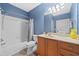 Stylish bathroom featuring a vanity, toilet, bathtub and shower with tile surround at 324 Providence Glen Dr, Chapel Hill, NC 27514