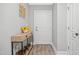 Inviting hallway featuring wood flooring, console table, and neutral paint at 324 Providence Glen Dr, Chapel Hill, NC 27514