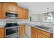 Well-equipped kitchen featuring granite countertops and stainless steel appliances at 324 Providence Glen Dr, Chapel Hill, NC 27514