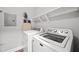 Functional laundry room with modern washer and dryer units and ample storage space at 324 Providence Glen Dr, Chapel Hill, NC 27514