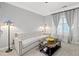 Stylish living room featuring comfortable seating, decorative lamps, and sheer curtains at 324 Providence Glen Dr, Chapel Hill, NC 27514