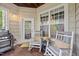 Relaxing porch with rocking chairs, wood flooring, and a view of the outdoors at 324 Providence Glen Dr, Chapel Hill, NC 27514