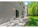 View of the back patio with sliding glass door entry to the home and view of the backyard at 3411 Massey Pond Trl, Raleigh, NC 27616